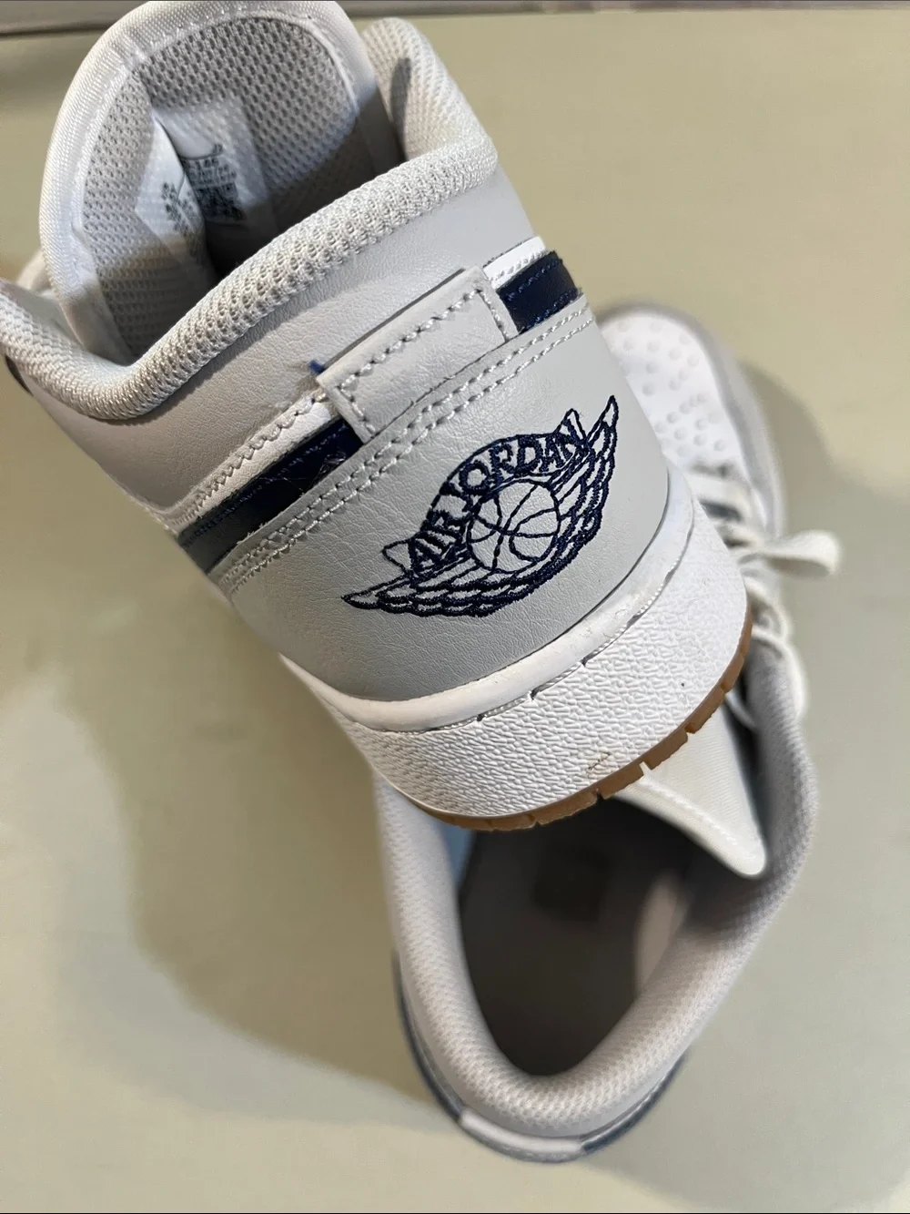 Nike Kids' White and Light Gray Low-Top Sneakers with Navy Logo